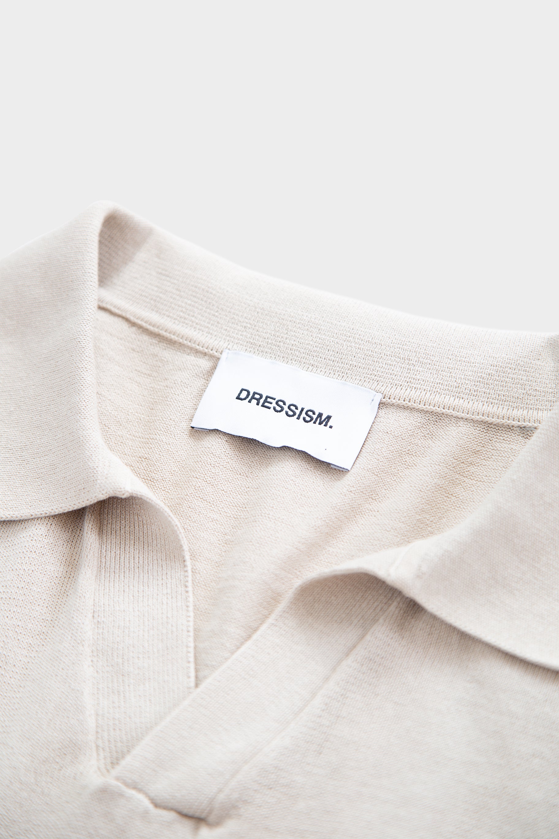 Sand-colored cotton polo shirt with open collar