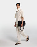 Loose fit trousers in ecru cotton poplin