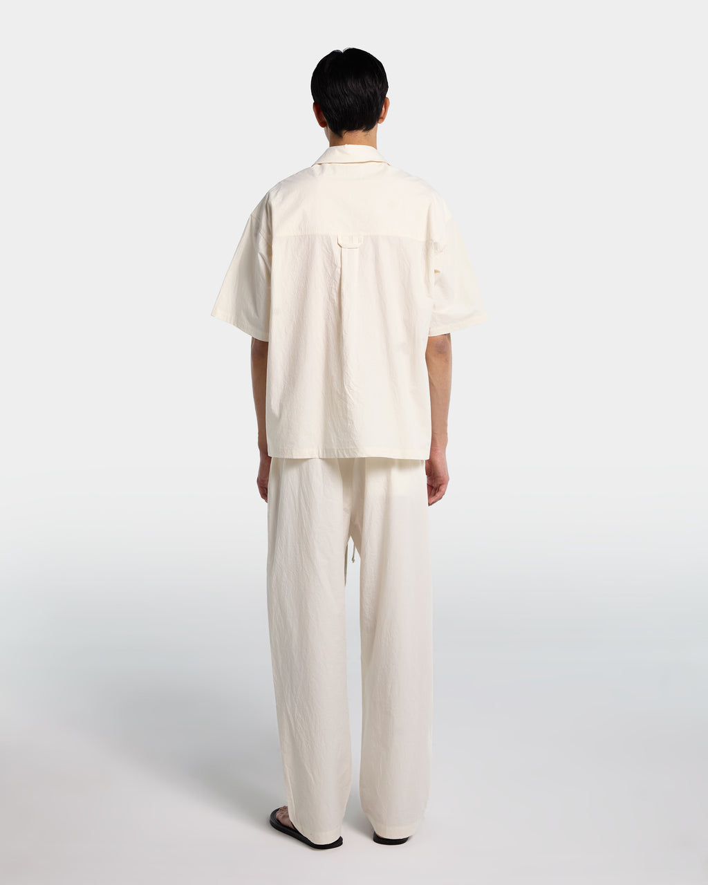 Loose fit trousers in ecru cotton poplin