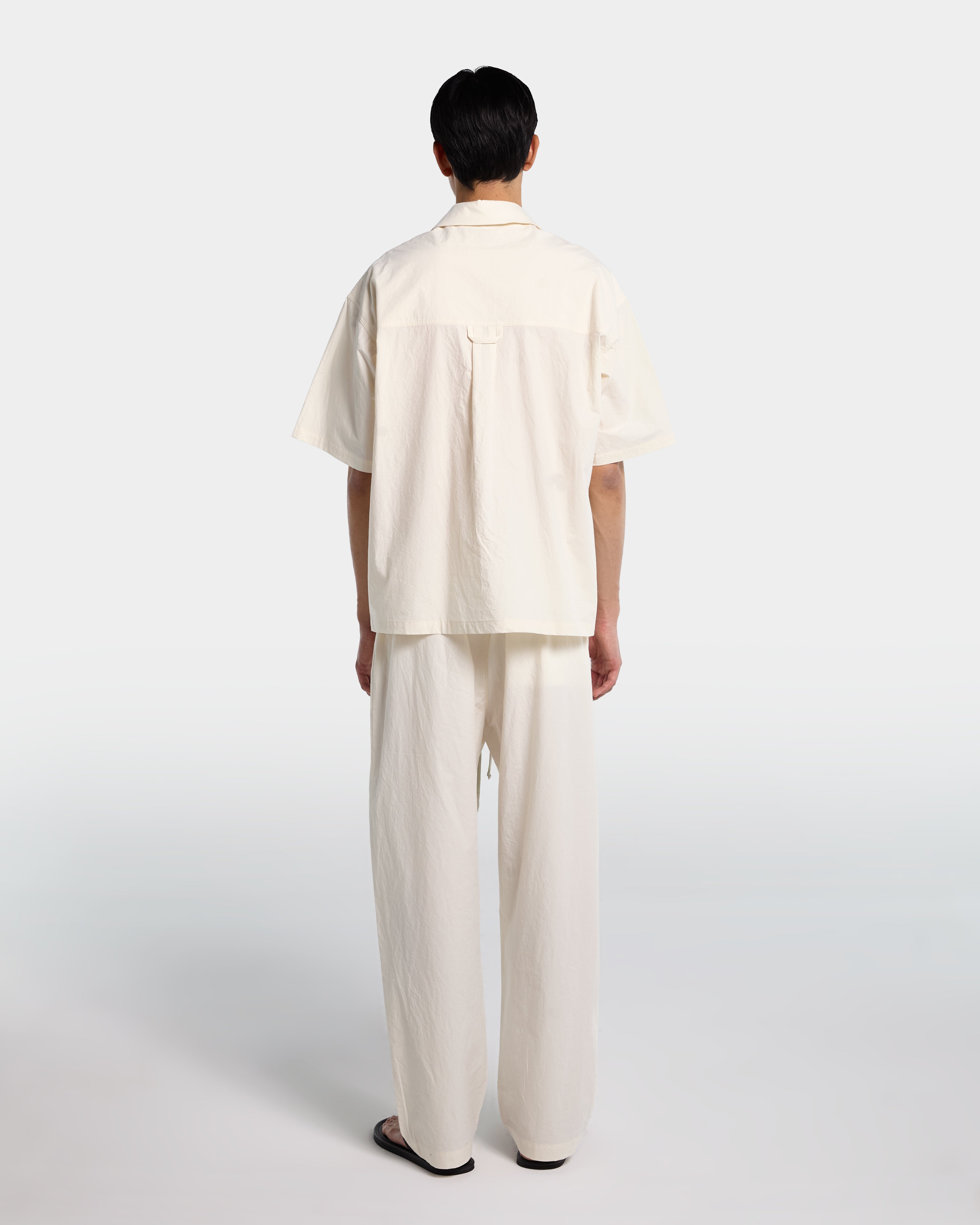 Loose fit trousers in ecru cotton poplin