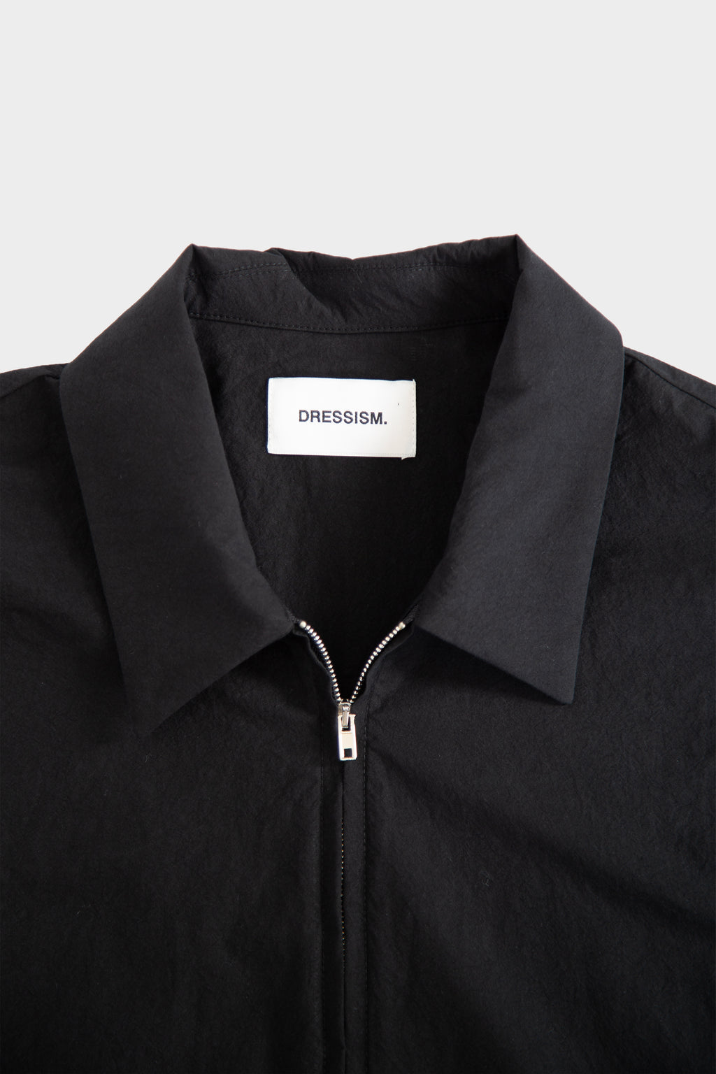 Black poplin shirt with zip and short sleeves