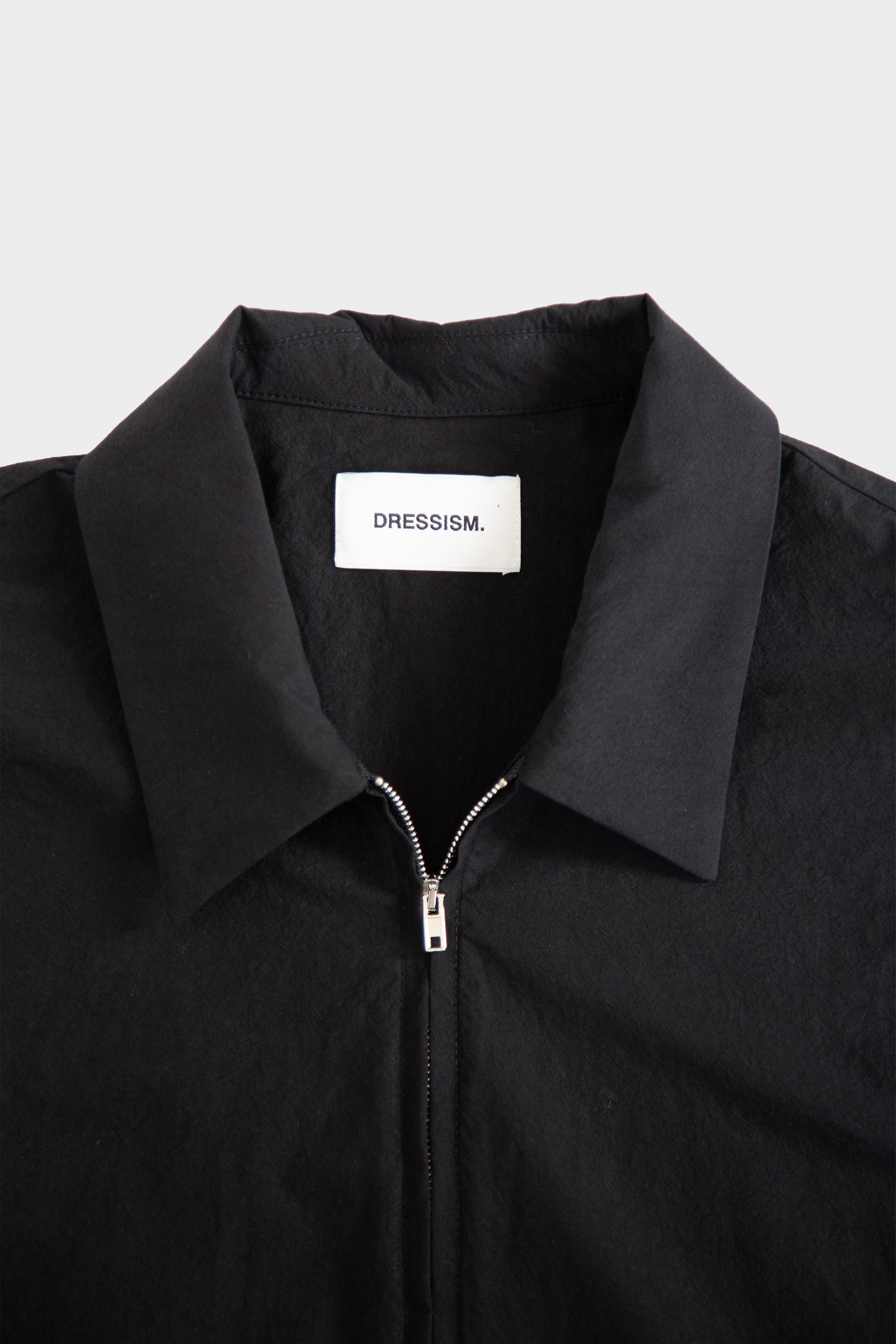 Black poplin shirt with zip and short sleeves