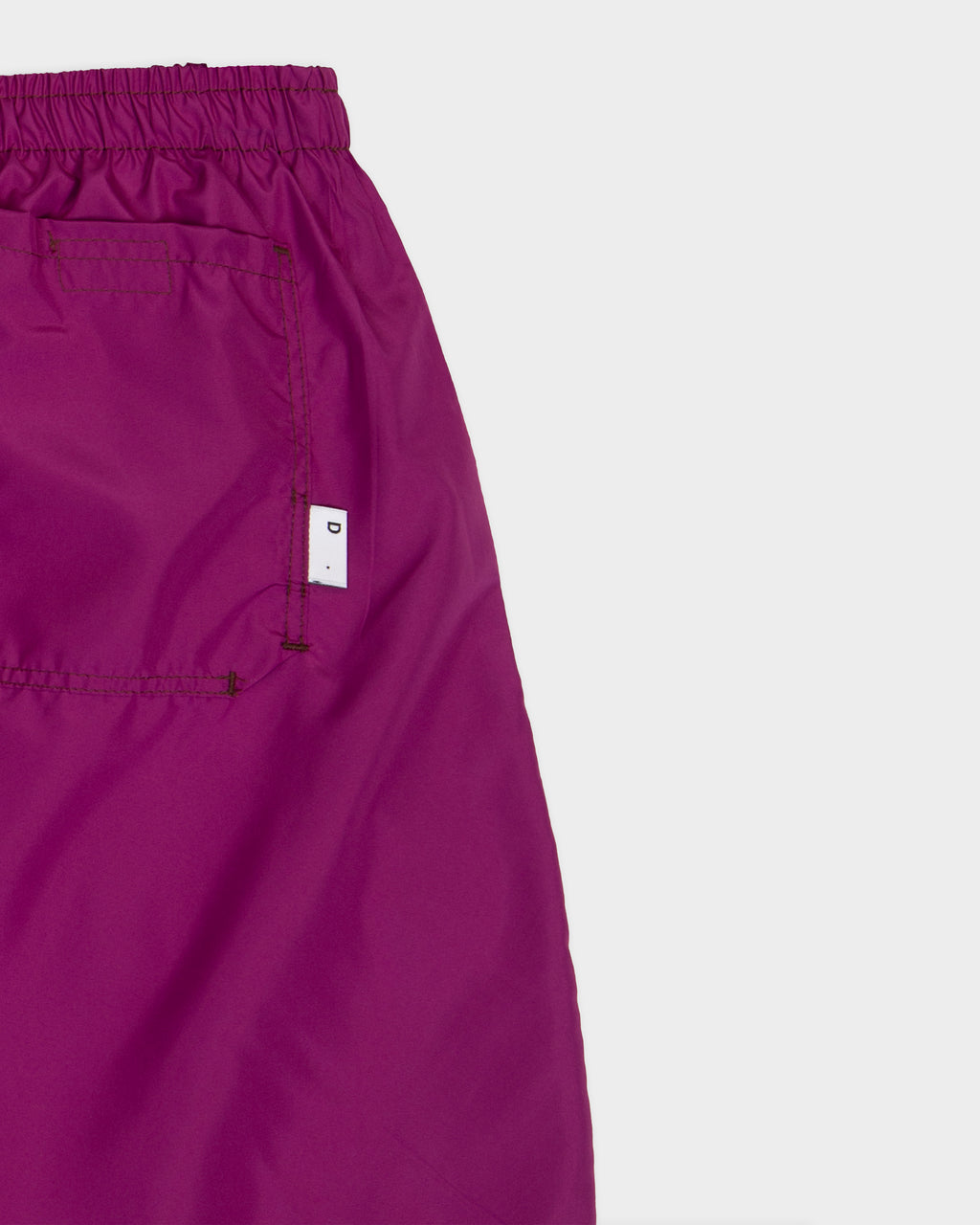 Cyclamen-colored nylon swim trunks