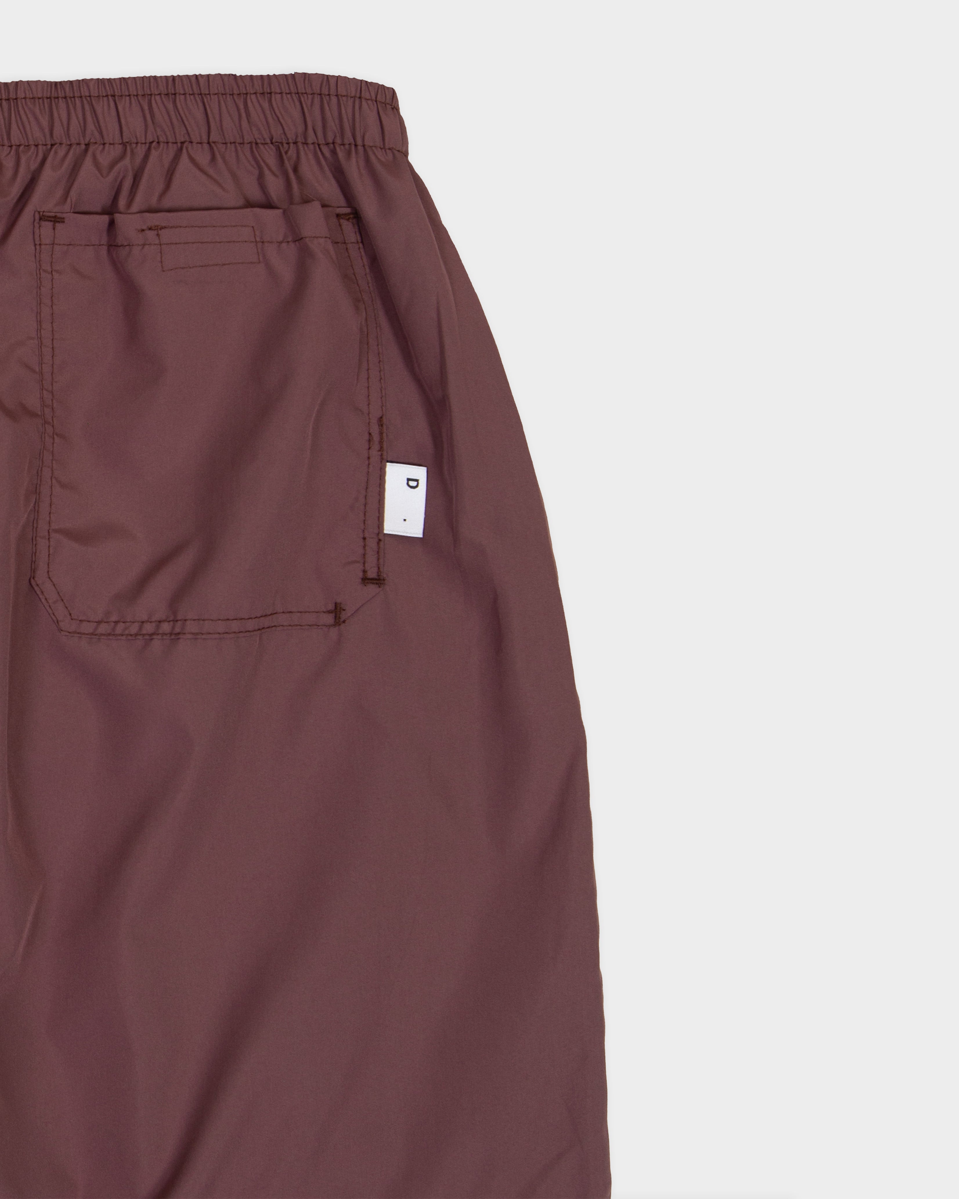 Mauve nylon swimming shorts