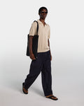 Sand-colored cotton polo shirt with open collar
