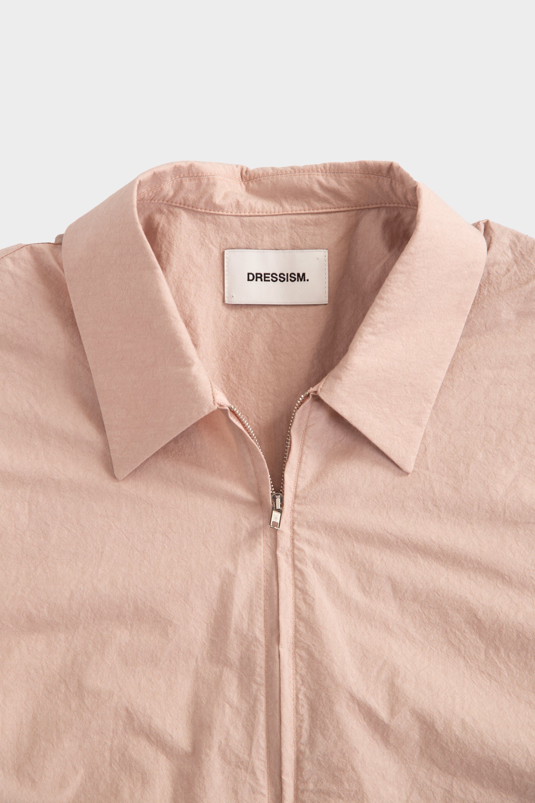 Pink poplin shirt with zip and short sleeves