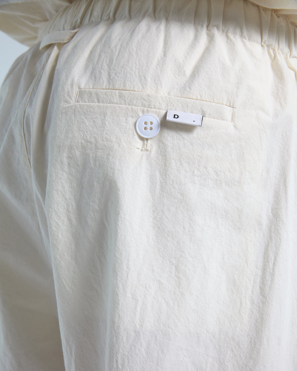 Loose fit trousers in ecru cotton poplin