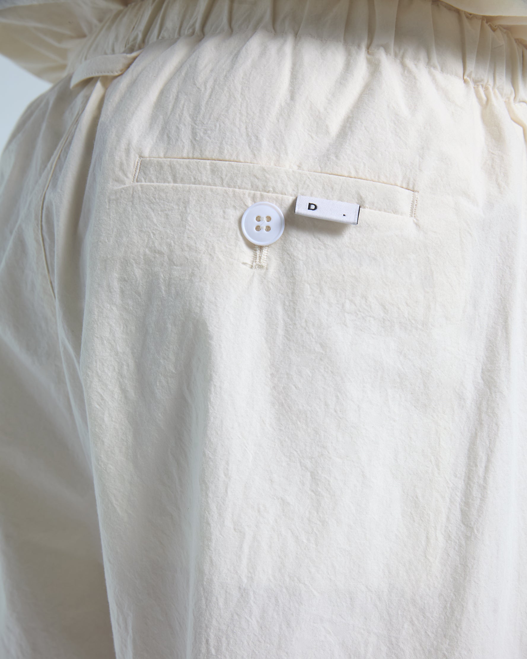 Loose fit trousers in ecru cotton poplin