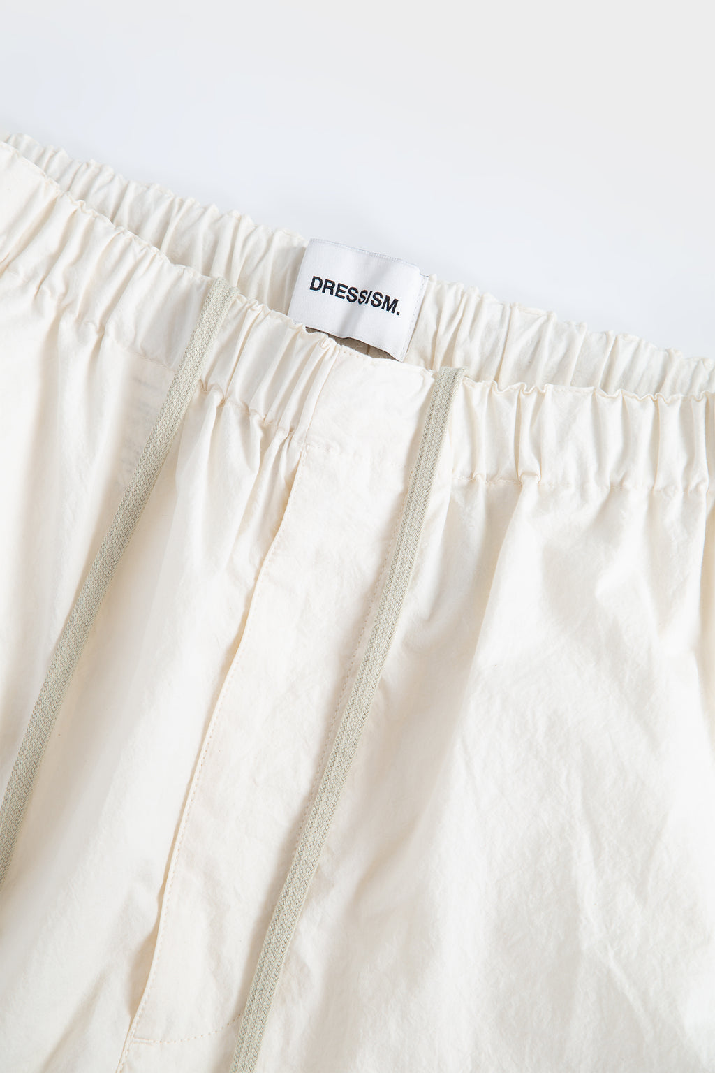 Loose fit trousers in ecru cotton poplin
